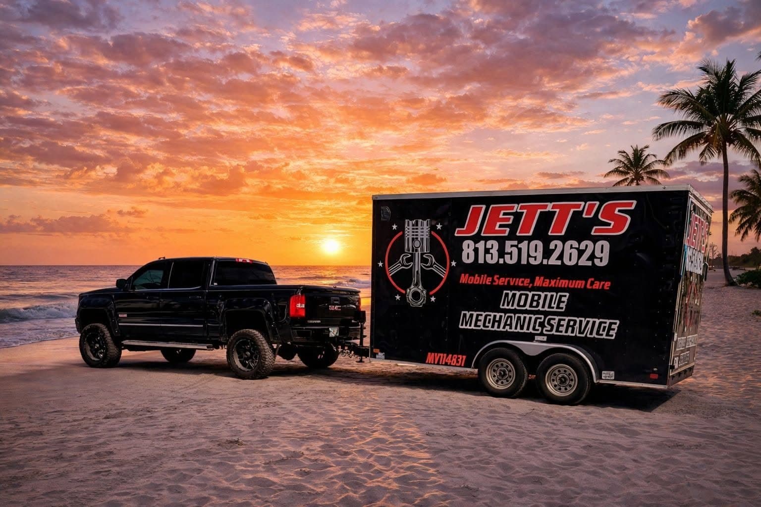 Jett's black pickup and enclosed mobile mechanic trailer parked on the sand at sunset